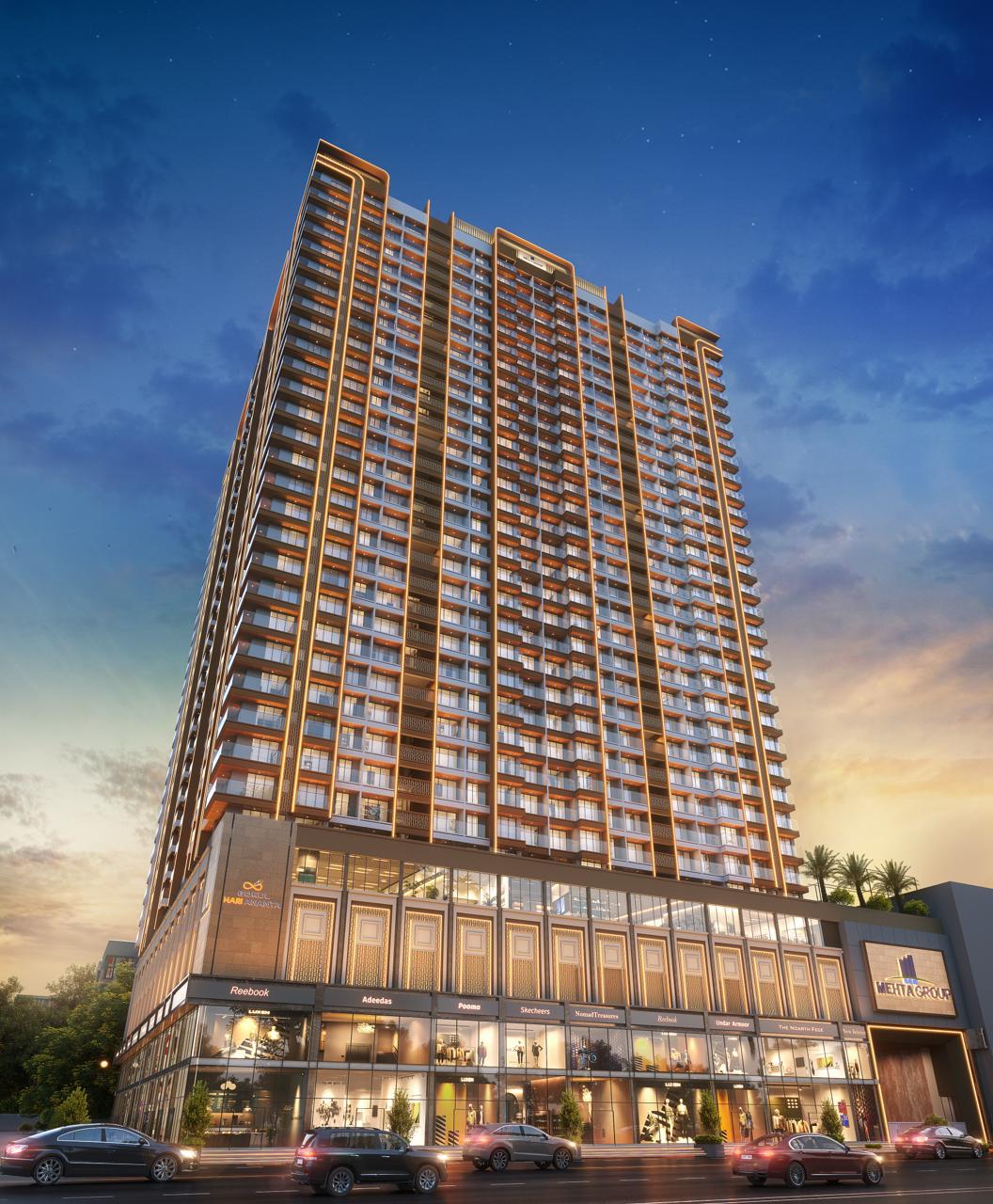 Night elevation view Gokul Hari Ananta illuminated gold facade Virar